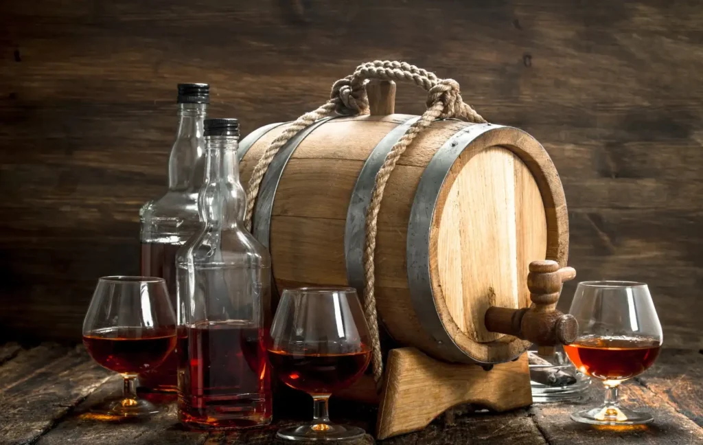 barrel-with-whiskey bottles-glasses