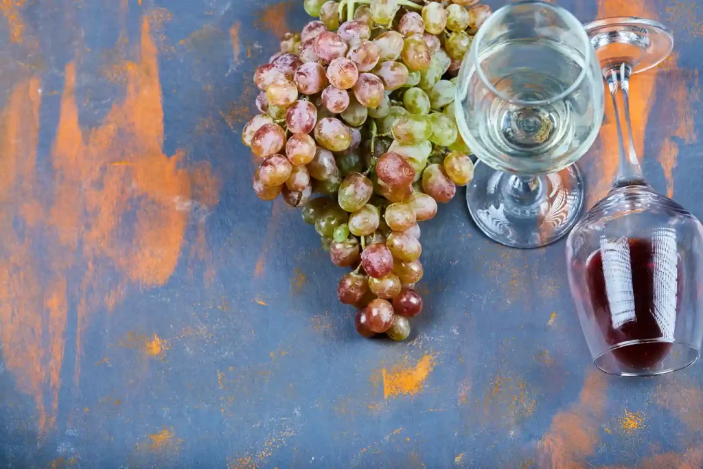 Red wine glass with grapes