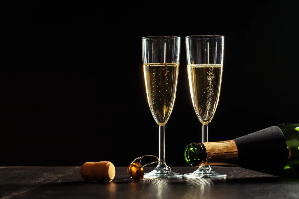 champagne glasses with black bottle