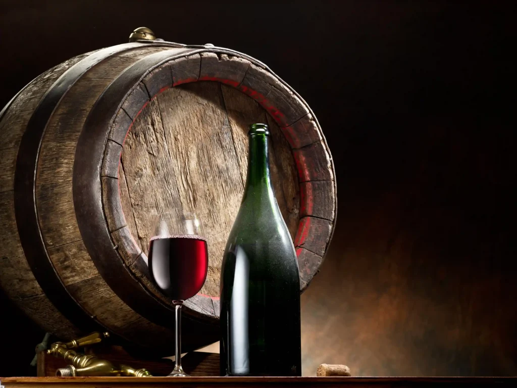 glass wine with bottle and barrel