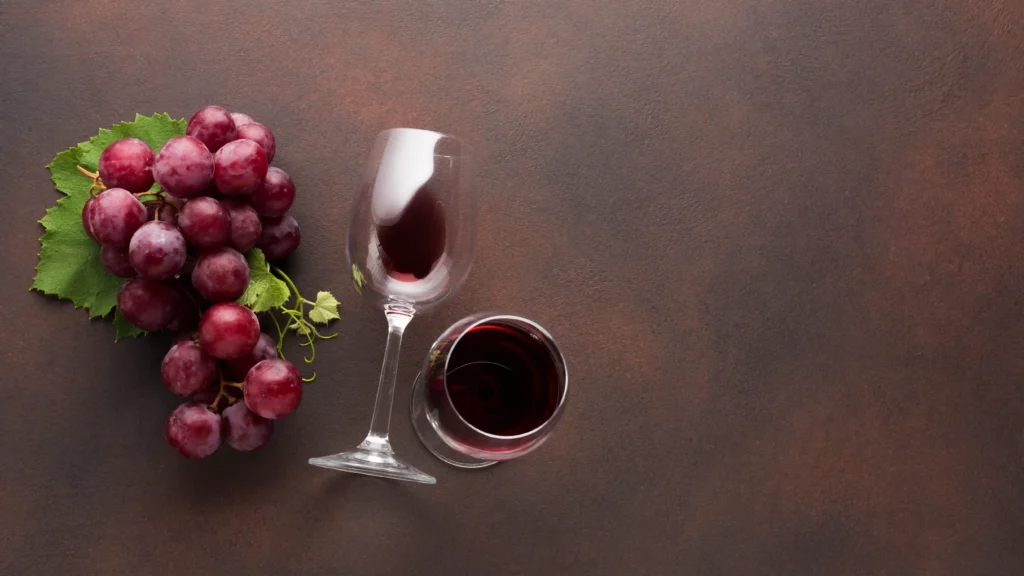 glasses red wine with grapes