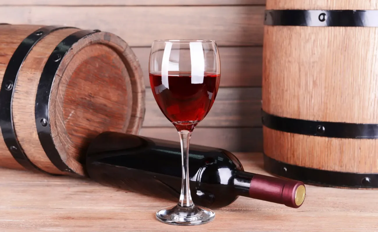 Port wine in glass & barrels