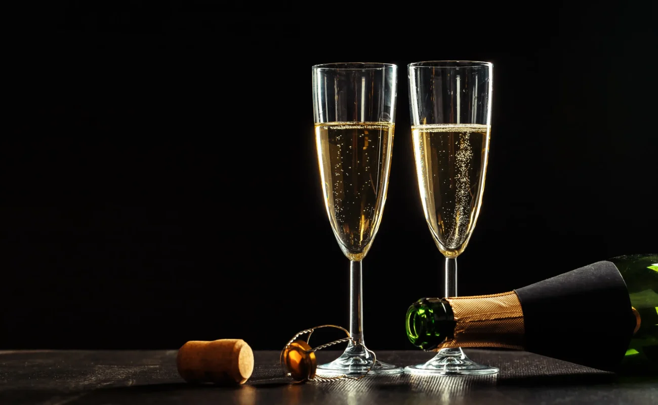 champagne glasses with black bottle