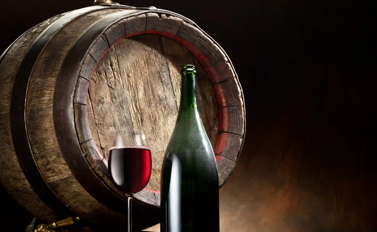glass wine with bottle and barrel
