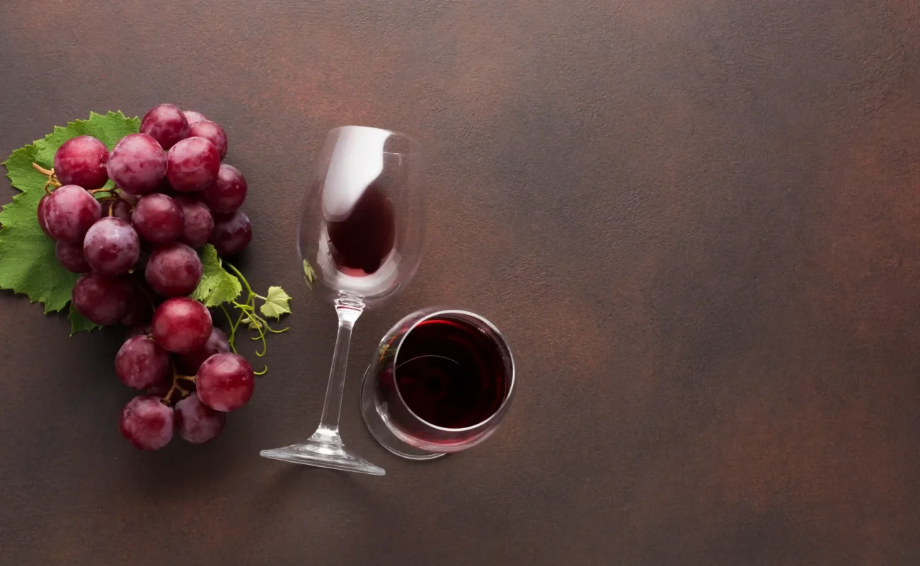 glasses red wine with grapes
