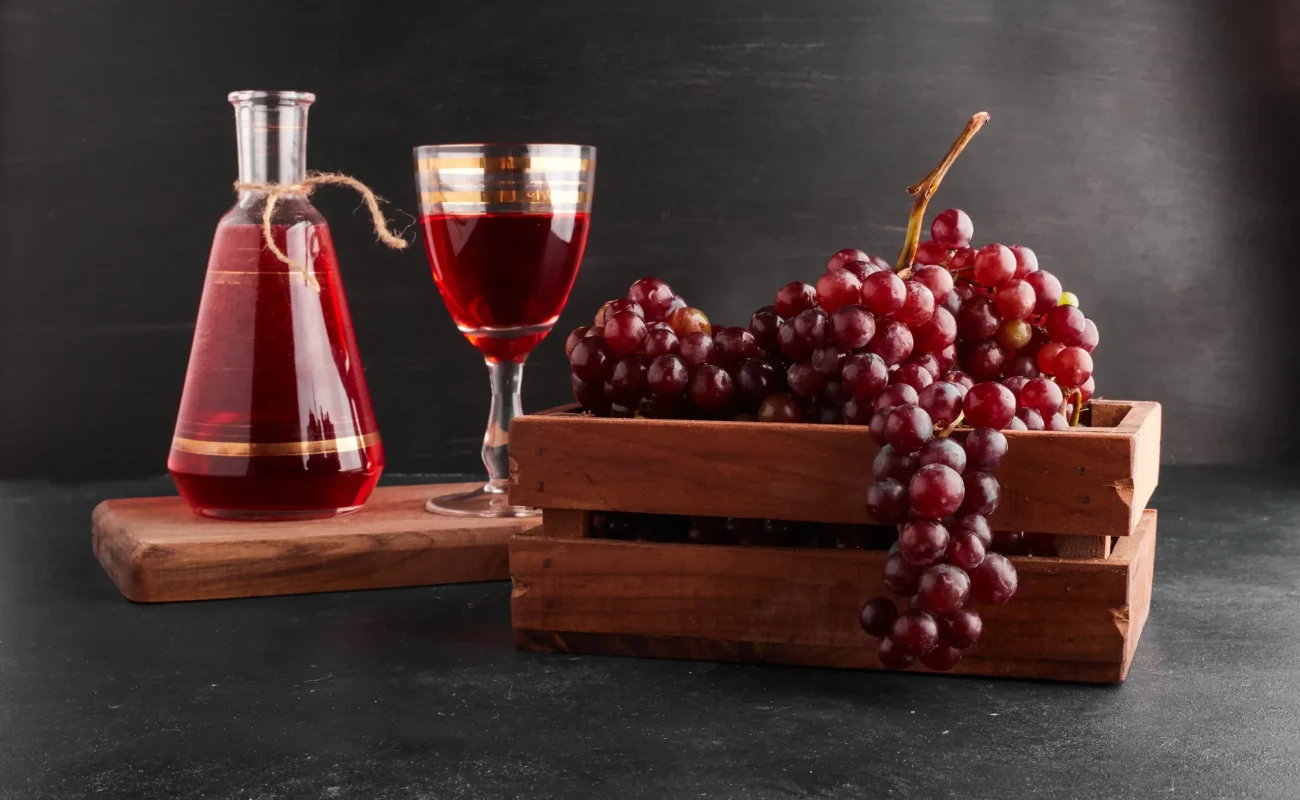 red wines grapes with wine glass