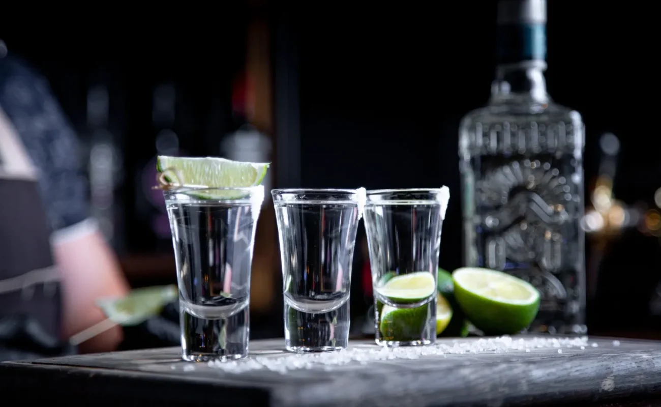 vodka-pouring-into-small-glasses